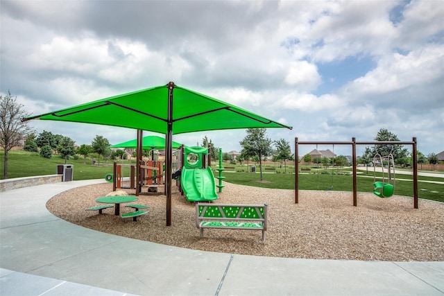 view of jungle gym featuring a lawn