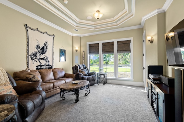 carpeted living room featuring ornamental molding and a raised ceiling