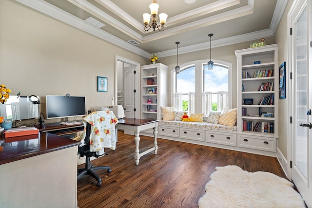 office space with ornamental molding, a notable chandelier, a tray ceiling, and dark hardwood / wood-style floors