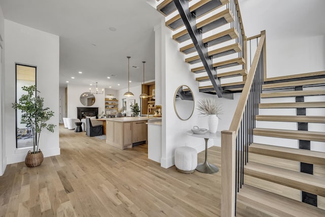 staircase featuring wood-type flooring