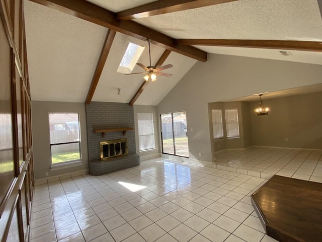 unfurnished living room with a healthy amount of sunlight, a brick fireplace, and light tile patterned flooring