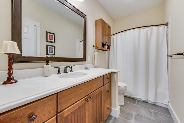 bathroom featuring toilet and vanity