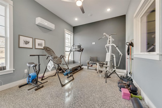 exercise area with a wall mounted AC and ceiling fan