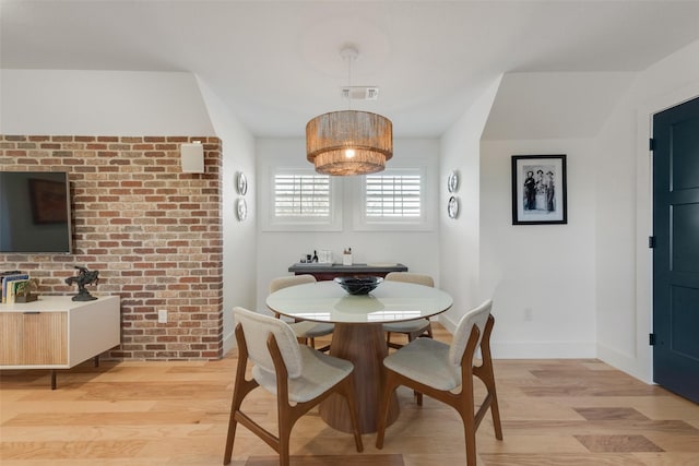 dining space with light wood-type flooring