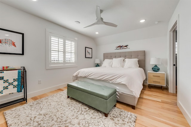 bedroom featuring hardwood / wood-style floors, ceiling fan, and vaulted ceiling