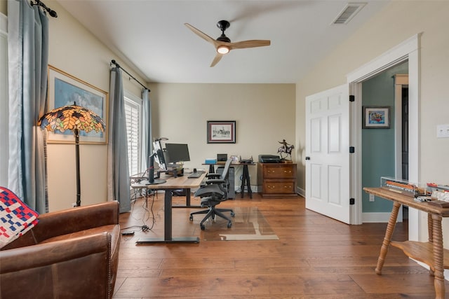 office with ceiling fan and hardwood / wood-style floors