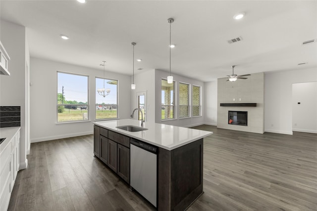 6801 Lancashire, Mesquite, TX 75126 - kitchen with dishwasher, a sink, a fireplace, dark wood finished floors, and recessed lighting