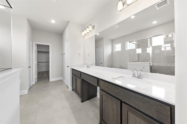 bathroom featuring vanity and a shower with shower door