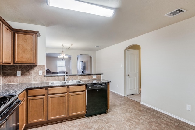 kitchen featuring a chandelier, sink, decorative backsplash, and black appliances