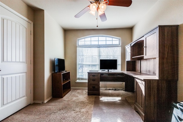 home office with ceiling fan, a healthy amount of sunlight, and light colored carpet