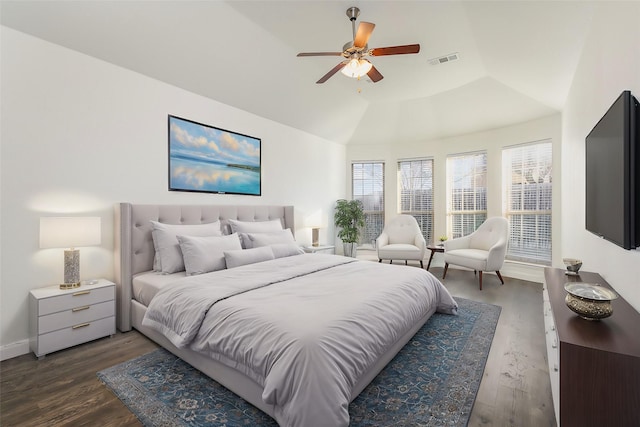 bedroom with dark wood-type flooring, ceiling fan, and vaulted ceiling