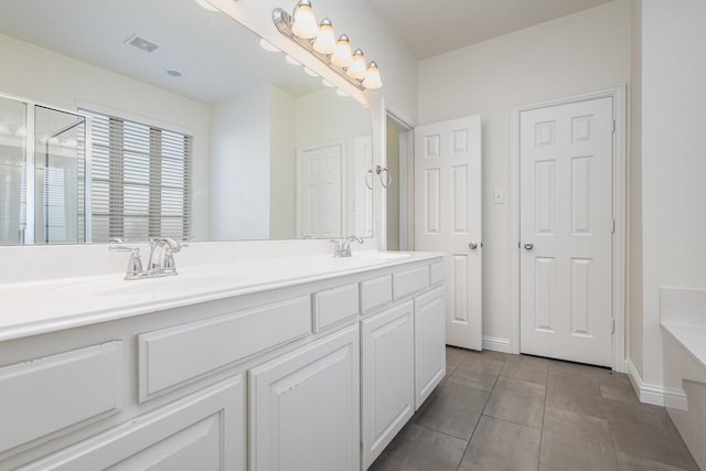 bathroom featuring vanity, tile patterned flooring, and separate shower and tub