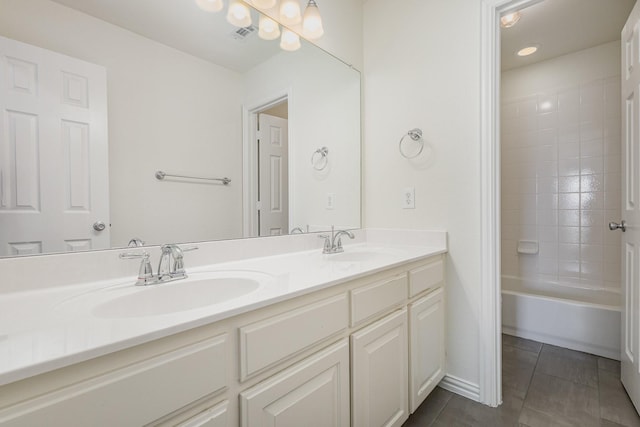 bathroom featuring vanity, tile patterned floors, and shower / tub combination