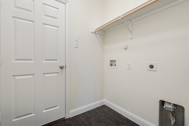 clothes washing area featuring electric dryer hookup, hookup for a washing machine, dark hardwood / wood-style flooring, and gas dryer hookup