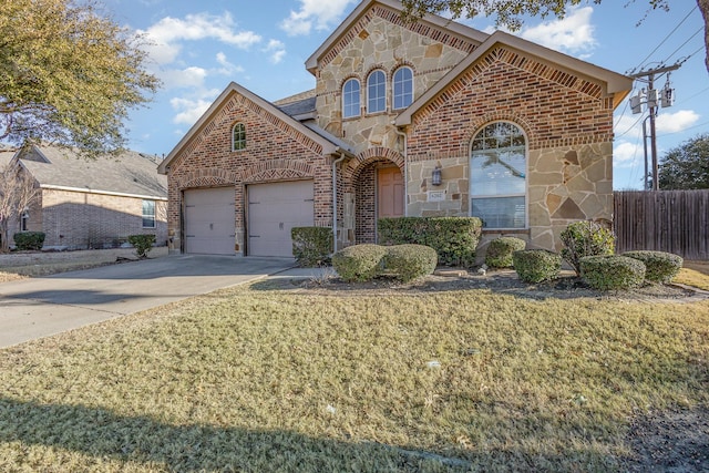 view of front property with a garage and a front yard