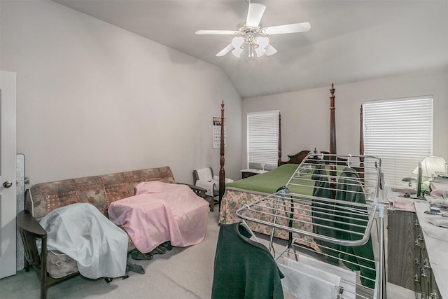 carpeted bedroom featuring vaulted ceiling and ceiling fan