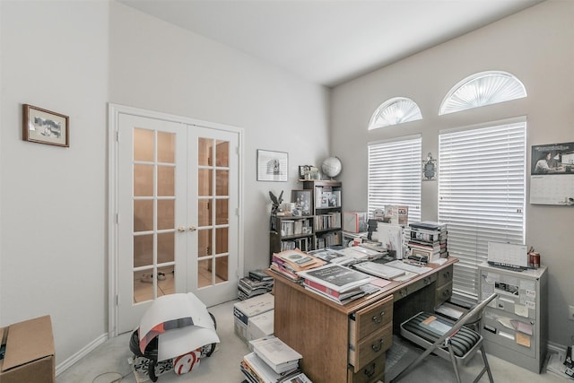 office area with light colored carpet and french doors