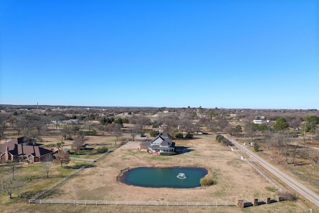 bird's eye view with a water view and a rural view