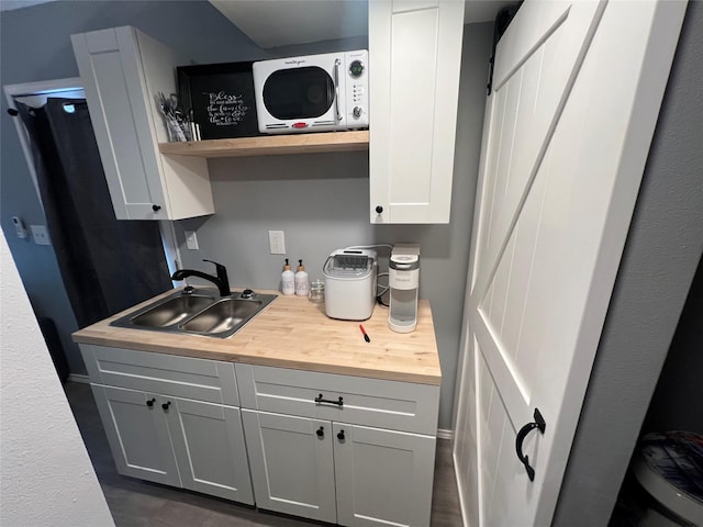 kitchen with gray cabinetry and sink