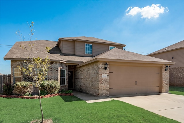 view of front of property featuring a garage and a front yard