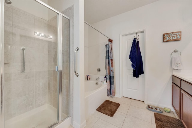 bathroom with tile patterned floors, vanity, and separate shower and tub