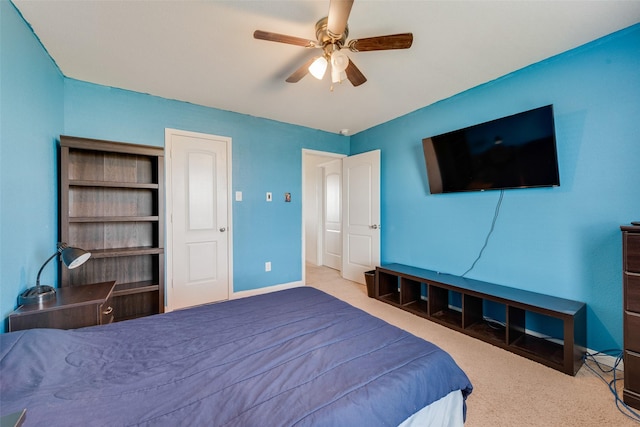 bedroom with ceiling fan and light colored carpet