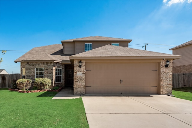 view of front of property with a garage and a front yard