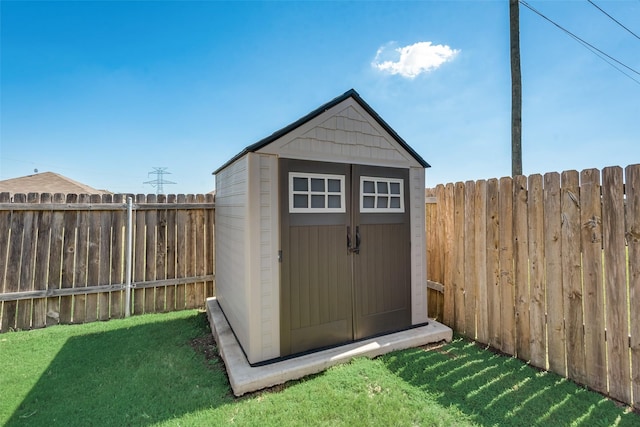 view of outbuilding with a yard