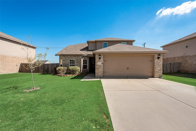 view of front of home featuring a front lawn and a garage