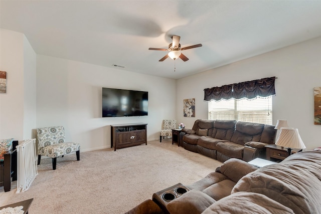 living room featuring ceiling fan and light carpet