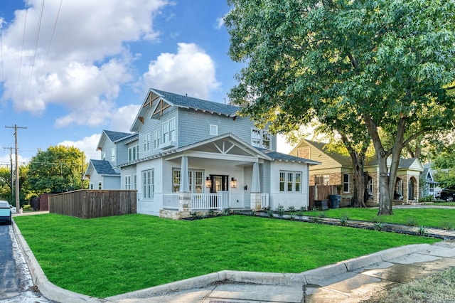 view of front of property with a porch and a front yard