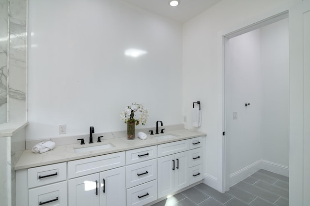 bathroom with tile patterned flooring and vanity