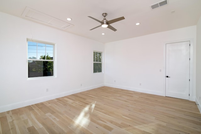 unfurnished room with ceiling fan and light hardwood / wood-style floors