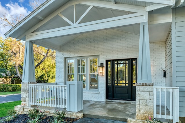 doorway to property featuring covered porch