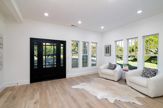 sitting room featuring light hardwood / wood-style floors