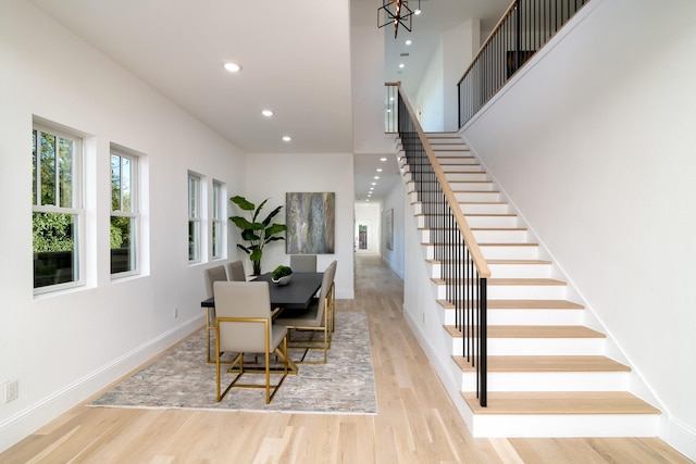 dining area featuring a notable chandelier and light hardwood / wood-style floors