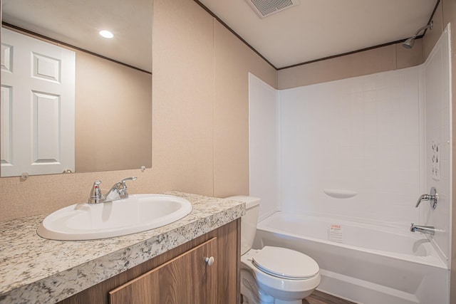 full bathroom featuring wood-type flooring, shower / tub combination, vanity, and toilet