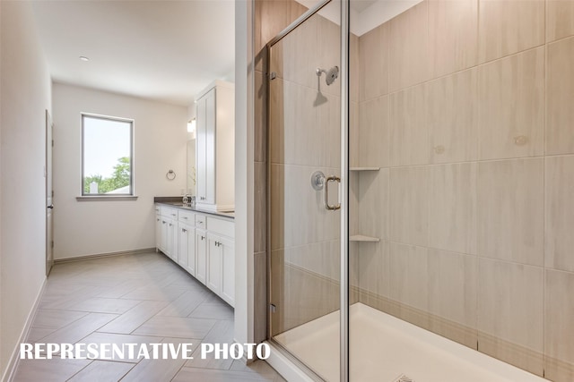 bathroom featuring an enclosed shower and vanity