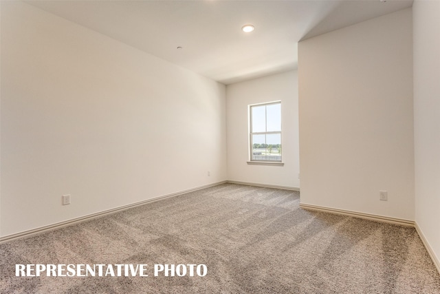 unfurnished room featuring carpet flooring