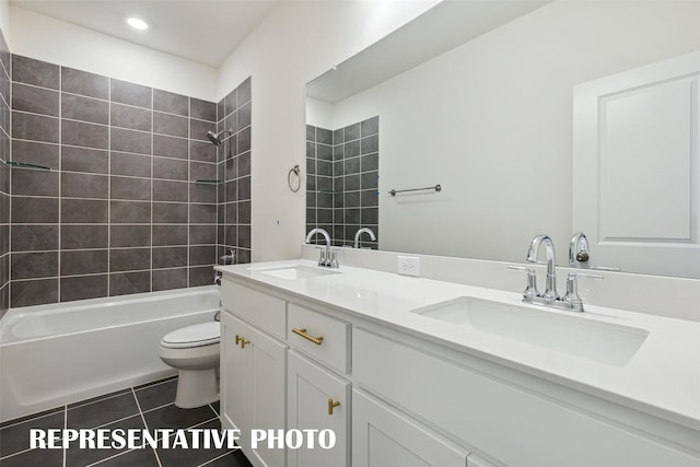 full bathroom with vanity, toilet, tile patterned floors, and tiled shower / bath