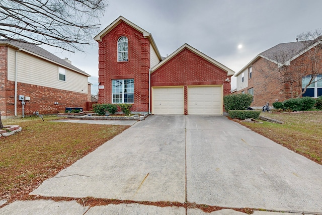 view of property featuring a front lawn and a garage