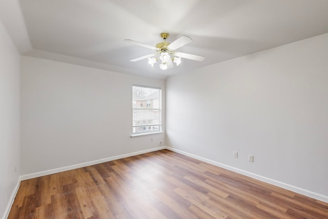 spare room with ceiling fan and hardwood / wood-style floors