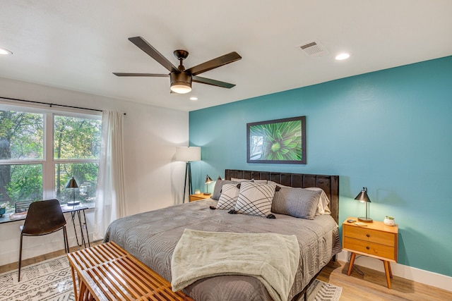 bedroom featuring hardwood / wood-style floors and ceiling fan