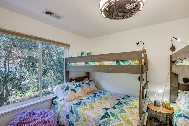 bedroom featuring multiple windows