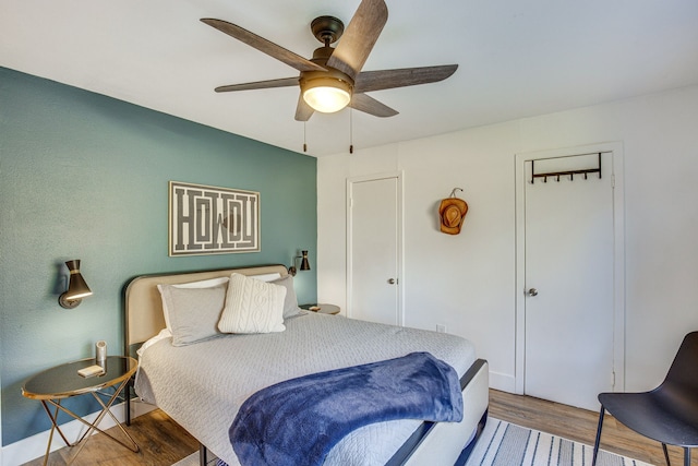 bedroom featuring ceiling fan and wood-type flooring