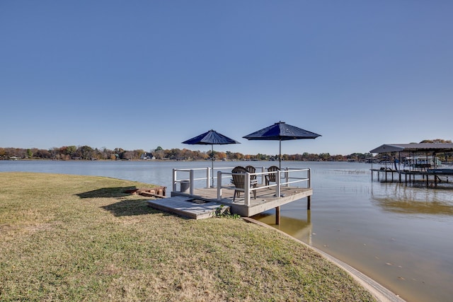 view of dock featuring a yard and a water view