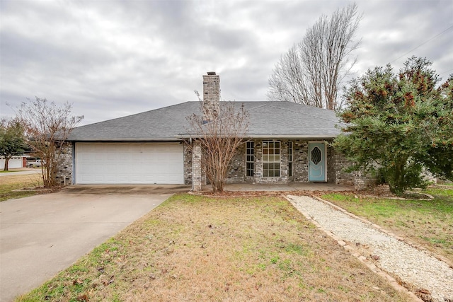 ranch-style house featuring a front yard and a garage