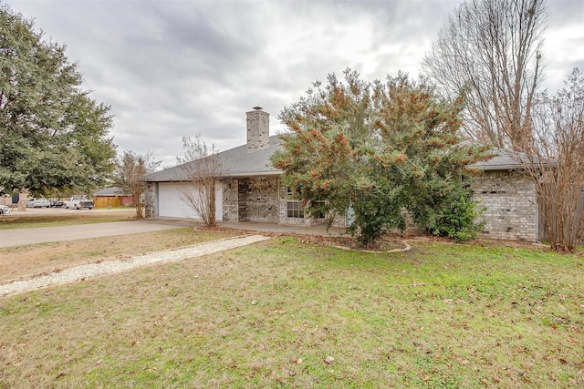 view of front of house with a front yard and a garage