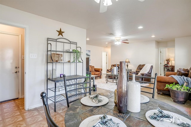 dining room featuring ceiling fan and parquet floors