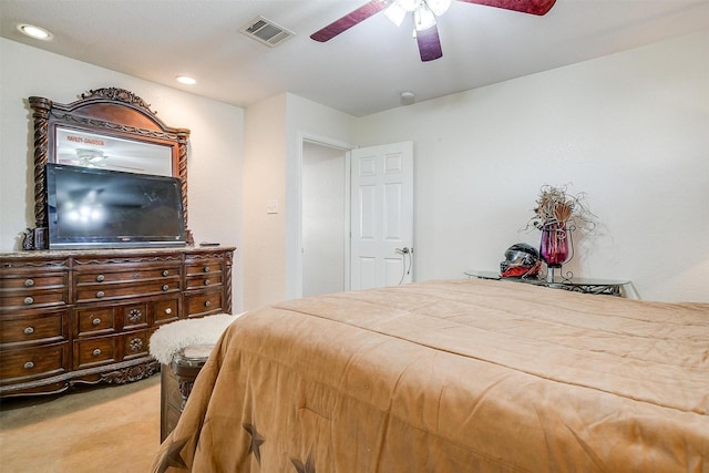 bedroom with ceiling fan and light colored carpet